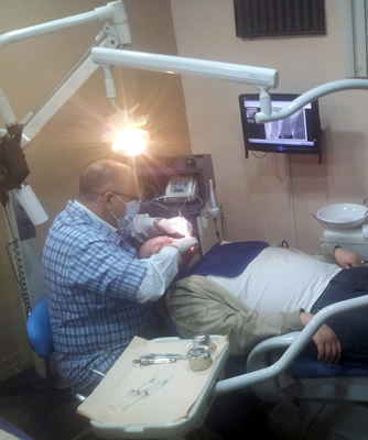 Al Barrus laying in Dentist's chair in Mexico