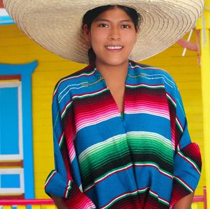 Person wearing Mexican serape blanket