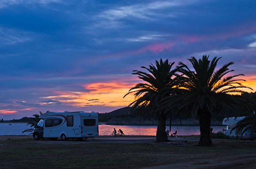 RV camped on ocean bay in Baja at sunset